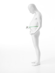 faceless man measures his abdomen