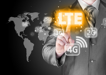 businessman is pushing his finger on lte button