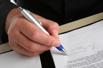 Business man siging a contract