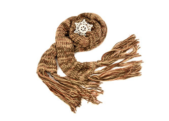 Brown winter scarf with fringe decorated with snowflake isolated