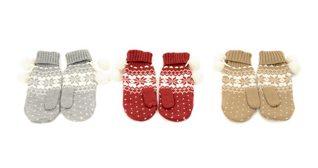 Winter mittens nicely arranged.Gloves with snowflakes isolared.