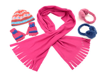 Pink and blue winter accessories isolated on white background.