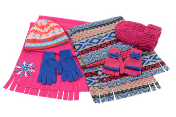 Pink and blue winter accessories isolated on white background.