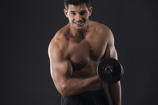 Muscular Man Lifting Weights