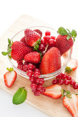 Fresh strawberry and redcurrant on white