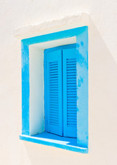 blue coloured wooden door in Amorgos island in Greece