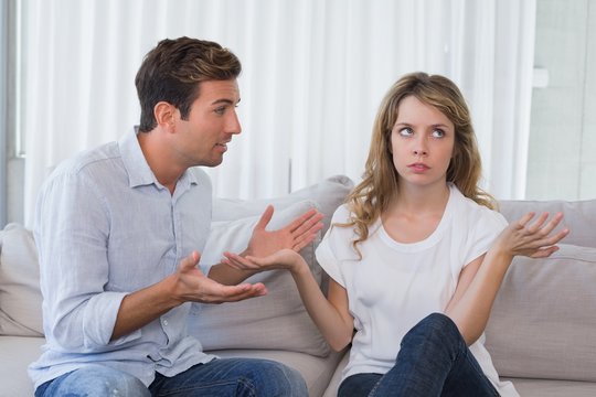 Couple having an argument in living room