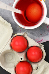 Red Easter eggs and liquid dye