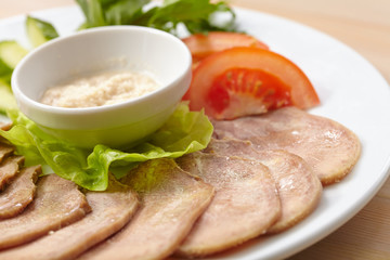Slices of boiled beef tongue