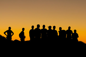 People silhouettes at sunset