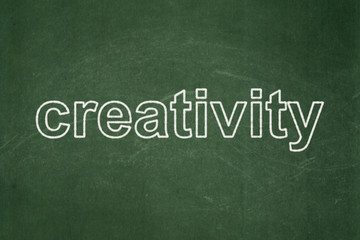 Advertising concept: Creativity on chalkboard background