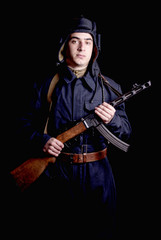 Fototapeta premium young Soviet tank driver with his gun