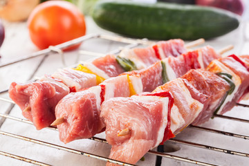 Raw shashlik and vegetables