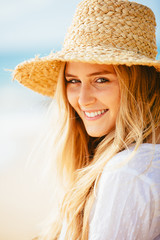 Portrait of beautiful blond girl on the beach