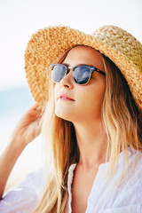 Fashion lifesytle, Portrait of beautiful blond girl on the beach