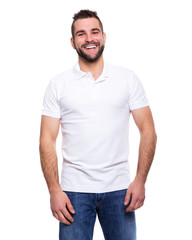Young happy man in a white polo shirt