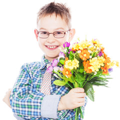 Handsome boy with flowers in hands