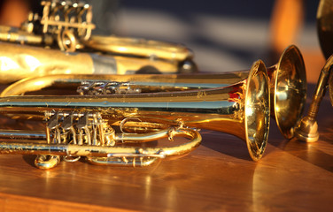 Fototapeta na wymiar Blowing brass wind instrument on table
