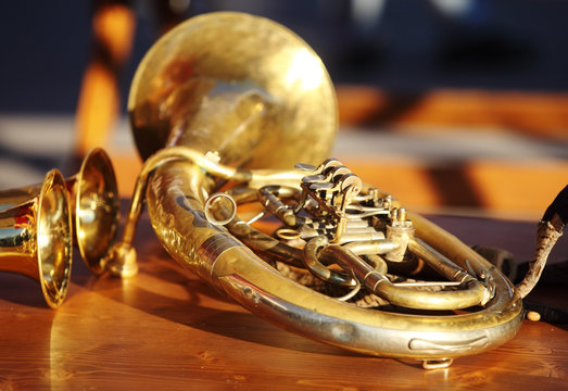 Blowing brass instrument on table