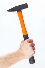 Hand of a joiner with a hammer on a white background