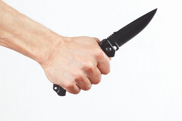 Hand holding a army knife on a white background