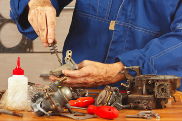 Repair of old parts automobile engine in the workshop