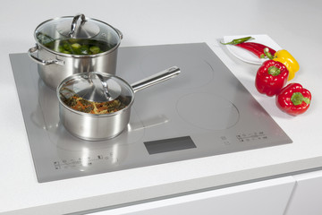 Grey glass induction hob in the kitchen