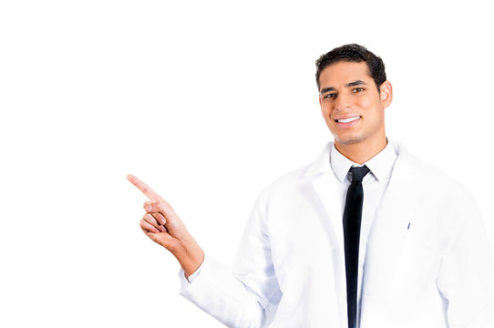 Happy Healthcare professional pointing at copy space 