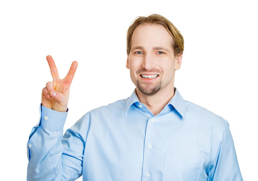 Victory, peace, two fingers sign. Happy man on white background 