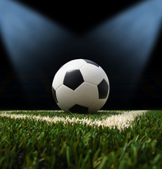 Soccer ball on the green field