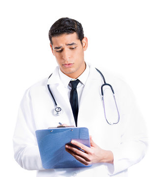 Confident male doctor with stethoscope and patient chart
