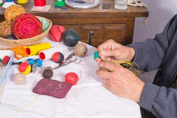 Male hand sewing