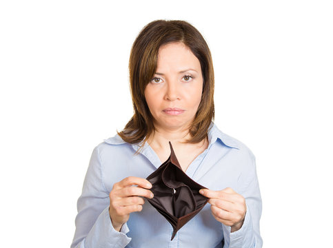 Broke sad woman without money, showing empty wallet