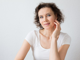 Happy brown-haired woman with attractive smile