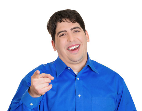 Young man pointing and laughing at you