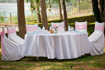 Table, chairs and decorations at a wedding, outdoor