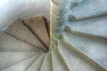 Spiral weathered staircase in an old castle