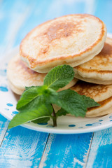 Close-up of fritters with mint leaves, vertical shot