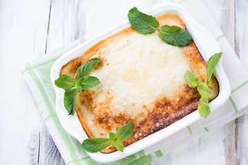 Vegetable lasagna with mint leaves, high angle view