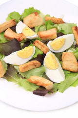 Caesar salad with eggs.