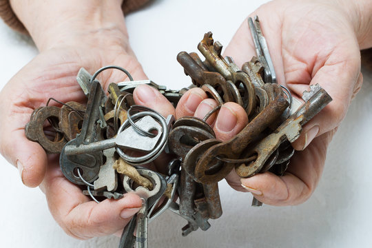 Bunch of old keys in hands.