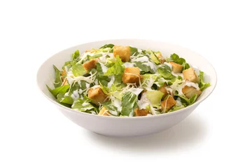 Deurstickers Caesar salad in a white plate © igorphoto50