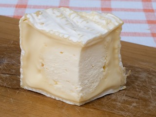 Slice of the cheese on the cutting board 2