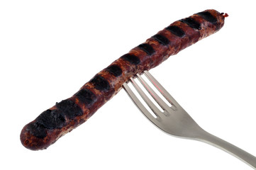 Merguez piquée sur une fourchette