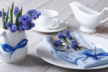 Elegant spring table setting with flowers muscari