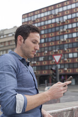 man typing text message