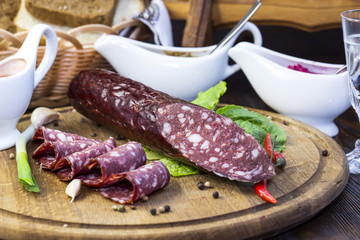 sausage on a wooden plate in a restaurant