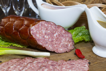 sausage on a wooden plate in a restaurant