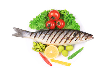 Grilled seabass with vegetables on plate.