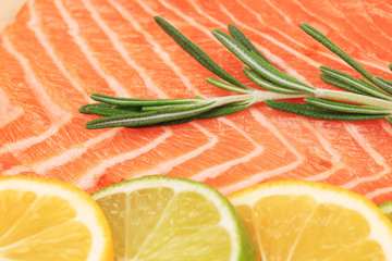 Closeup of salmon steak with rosemary.